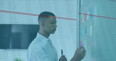 Image of data processing against african american man sticking memo notes a.. Stock Photos