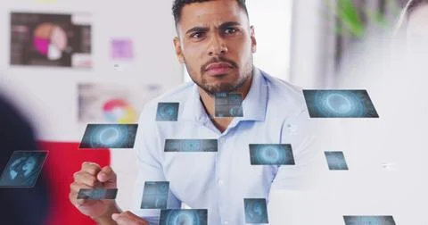Image of data processing against biracial man discussing with his colleagues at Stock Photos