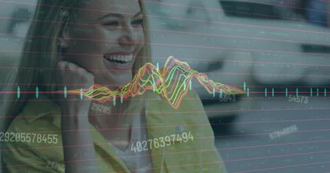Image of data processing against caucasian woman smiling while talking to her 写真素材