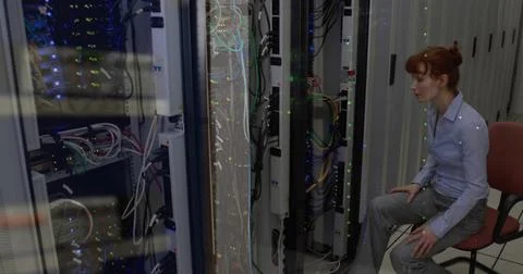 Image of data processing against caucasian female engineer working at server Stock Photos