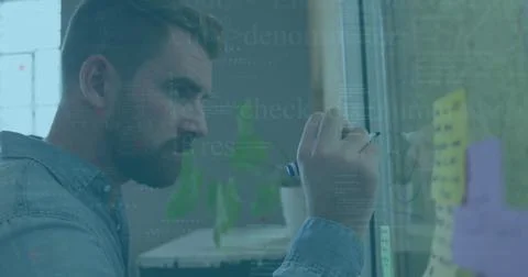 Image of data processing against caucasian man writing on memo notes at office Stock Photos