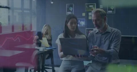 Image of data processing against diverse man and woman discussing over a la.. 스톡 사진