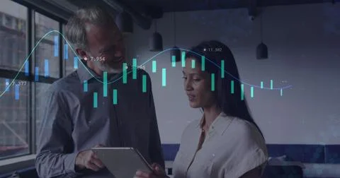 Image of data processing against diverse man and woman discussing over a ta.. Stock Photos