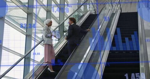 Image of data processing against diverse man and woman discussing on escalator Stock Photos