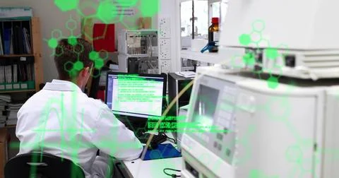 Image of data processing against rear view of male scientist using computer at Foto stock