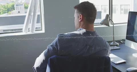 Image of data processing against thoughtful caucasian man sitting on his desk at Stock Photos