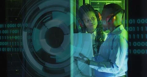 Image of data processing and binary coding over diverse it engineers and Stock Photos