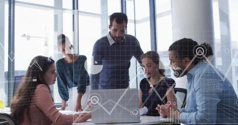 Image of data processing and diagrams over diverse colleagues discussing work in Stockfoto's