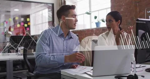 Image of data processing and diagrams over diverse colleagues discussing work in Stockfoto's