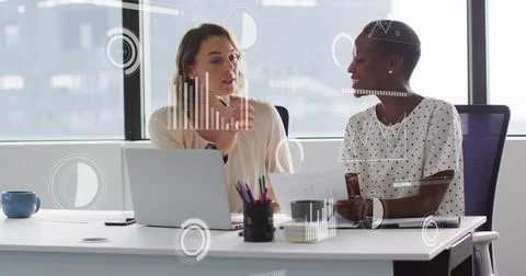 Image of data processing and diagrams over diverse female colleagues discussing Stockfoto's