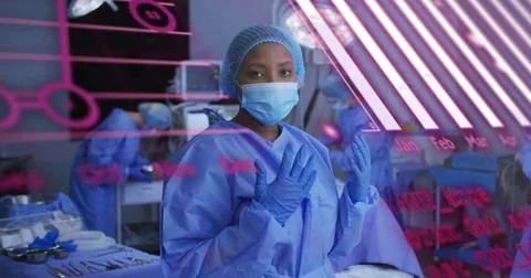 Image of data processing and diagrams over diverse surgeons in operating room Foto stock