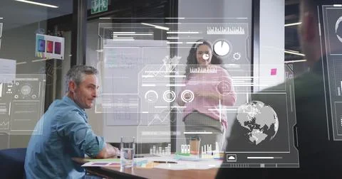 Image of data processing and diagrams over diverse colleagues discussing work Stockfoto's