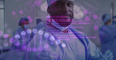 Image of data processing and dna strand over diverse surgeons wearing face masks Foto stock