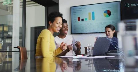 Image of data processing and globe over diverse business people high fiving in Stock Photos
