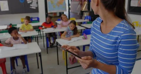 Image of data processing and globe over diverse schoolchildren in class Stock Photos
