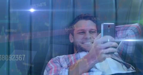 Image of data processing and light trails over caucasian man using smartphone Stock Photos