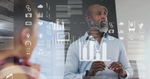 Image of data processing and media icons over diverse colleagues discussing work Stockfoto's
