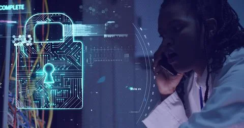 Image of data processing and padlock over african american woman working in 写真素材