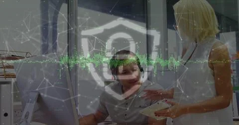 Image of data processing and padlock over caucasian business people in office 写真素材