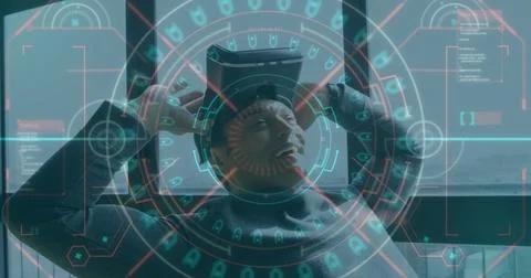 Image of data processing and scope scanning over smiling man wearing vr headset Stock Photos