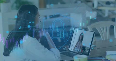Image of data processing and security padlock over woman using laptop 写真素材