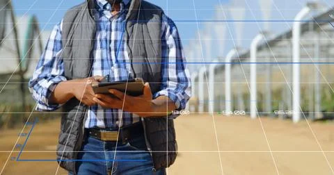 Image of data processing and statistics over biracial engineer using tablet Stock Photos