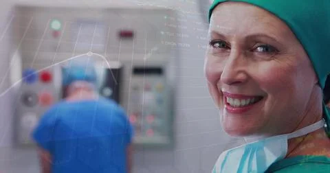 Image of data processing and stock market over caucasian surgeons in operating 写真素材