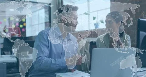 Image of data processing and world map over diverse man and woman discussing at Stock Photos