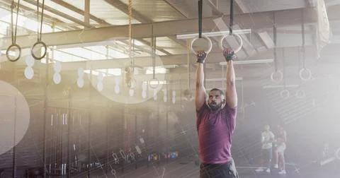 Image of data processing on interface over biracial man cross training using gym Foto stock