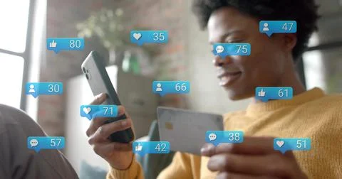 Image of data processing over african american man paying with card over Stock Photos