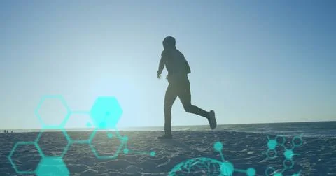 Image of data processing over african american man running at beach 库存照片
