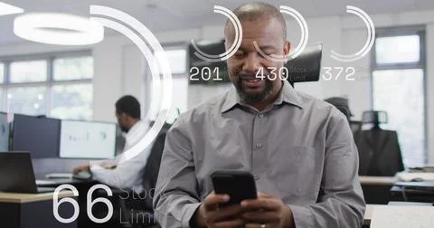Image of data processing over african american businessman using smartphone in 写真素材