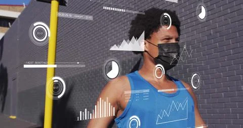 Image of data processing over african american man with face mask Stock-Fotos