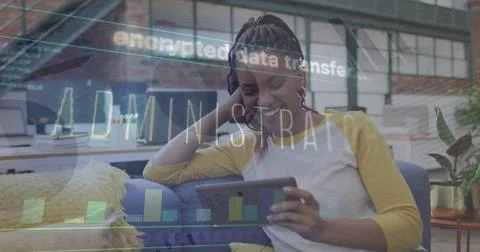 Image of data processing over african american businesswoman using tablet Stock Photos
