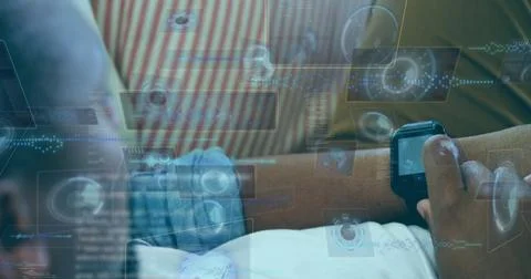 Image of data processing over african american man using smartwatch Stock Photos