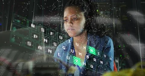 Image of data processing over african american businesswoman using computer Foto stock