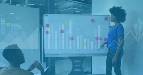 Image of data processing over african american man and woman discussing ove.. Stock Photos