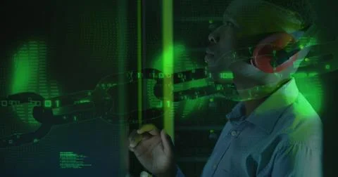 Image of data processing over african american male worker in server room 写真素材