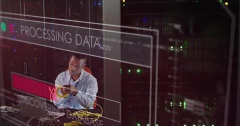 Image of data processing over african american working on laptop in server room Stockfoto's