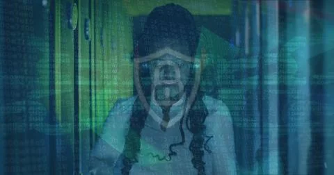 Image of data processing over african american female server room worker using Stockfoto's