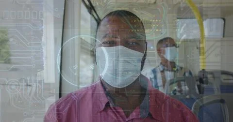 Image of data processing over african american man in bus with face mask 写真素材