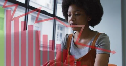 Image of data processing over african american businesswoman using laptop Stock Photos