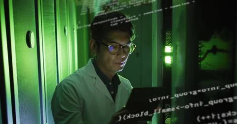 Image of data processing over asian man checking servers 库存照片