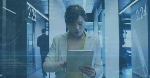 Image of data processing over asian businesswoman using tablet in office Stock Photos