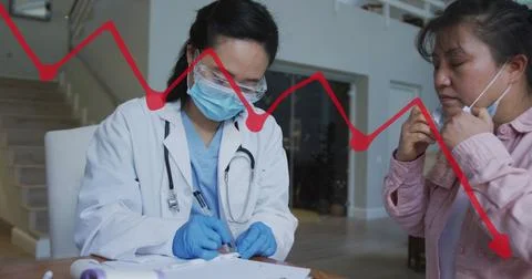 Image of data processing over asian female doctor writing with patient Foto stock