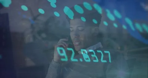 Image of data processing over biracial businessman working in office Foto stock