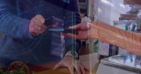 Image of data processing over biracial man paying with smartphone Foto stock