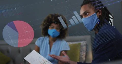 Image of data processing over biracial businessman with face mask Foto stock