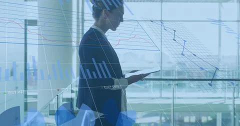 Image of data processing over caucasian businesswoman using tablet Foto stock