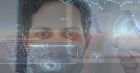 Image of data processing over caucasian man wearing face mask getting his Foto stock